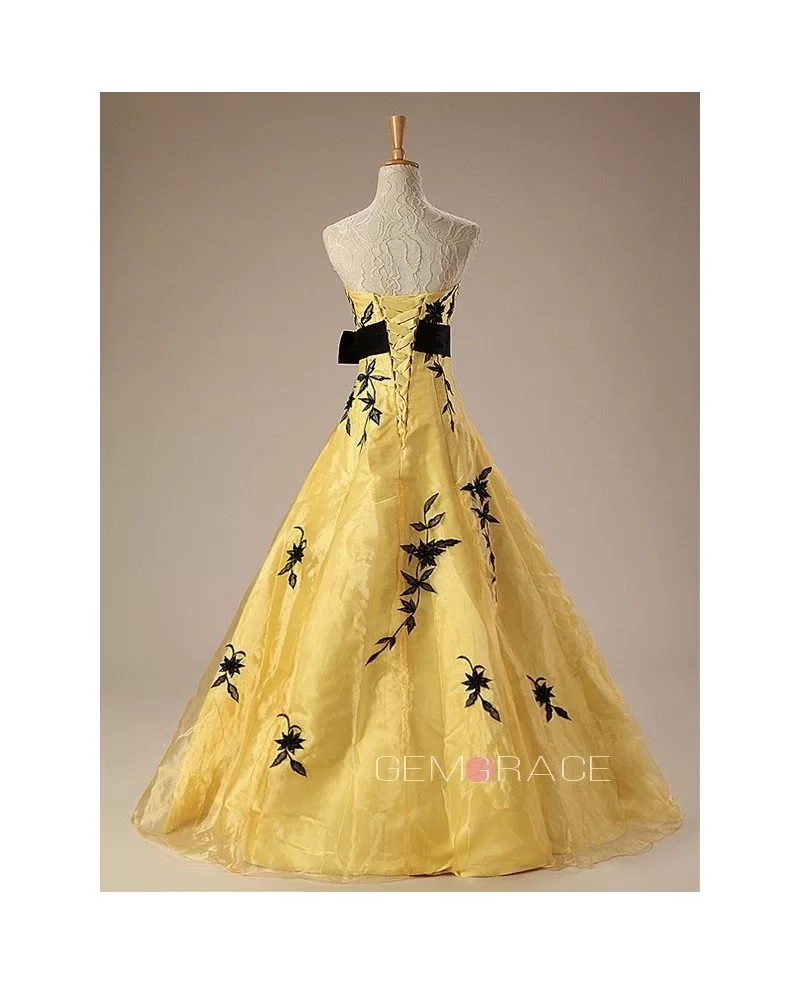 black and yellow strapless embroidered wedding dress with sash