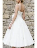 Chic White Tea Length Wedding Dress With Illusion Neckline And Feather Accent