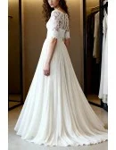 Gentle Ivory Lace Wedding Dress With Three Quarter Sleeves And Flowy Skirt