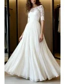 Gentle Ivory Lace Wedding Dress With Three Quarter Sleeves And Flowy Skirt