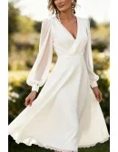 Elegant White Tea Length Wedding Dress With Long Lantern Sleeves And V-Neckline