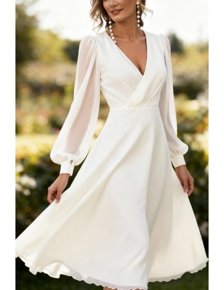 Elegant White Tea Length Wedding Dress With Long Lantern Sleeves And V-Neckline