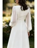 Elegant White Tea Length Wedding Dress With Long Lantern Sleeves And V-Neckline