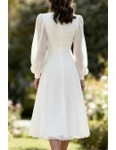 Elegant White Tea Length Wedding Dress With Long Lantern Sleeves And V-Neckline